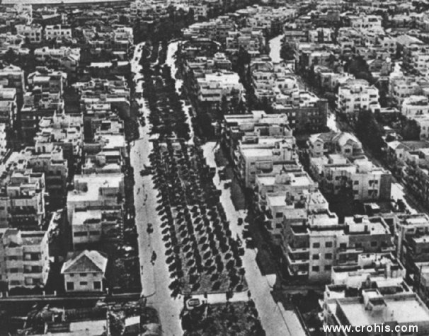 Novi grad u Tel Avivu. Uspješnim se pokazalo naseljavanje Židova (pretežno europskog podrijetla) u Palestini već u razdoblju između dva svjetska rata. Simbol tog uspjeha je po zapadnom uzoru izgrađen Tel Aviv. Usprkos službenom antisemitizmu fašističke Italije ova je slika ipak našla mjesto u atlasu.