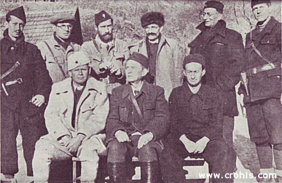 Izvršni komitet AVNOJ-a. Izvršni odbor AVNOJ-a (Antifašističko vijeće narodnog oslobođenja Jugoslavije) izabran na zasjedanju u Bihaću (26/27. 11. 1942.). Snimljen 1943. negdje u Crnoj Gori. Sjede: (s lijeva na desno) Nurija Pozderac, Ivan Ribar i Pavle Savić. Stoje (s lijeva na desno): Mladen Iveković, Veselin Masleša, Vlada Zečević, Ivan Milutinović i Mile Pruničić. Izvršni odbor AVNOJ-a trebao je predstavljati začetak buduće jugoslavenske vlade.